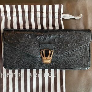 Henri Bendel black ostrich leather with gold hardware clutch